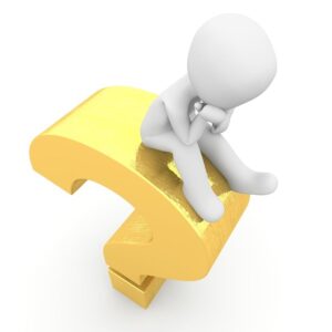 figure sits on a yellow question mark